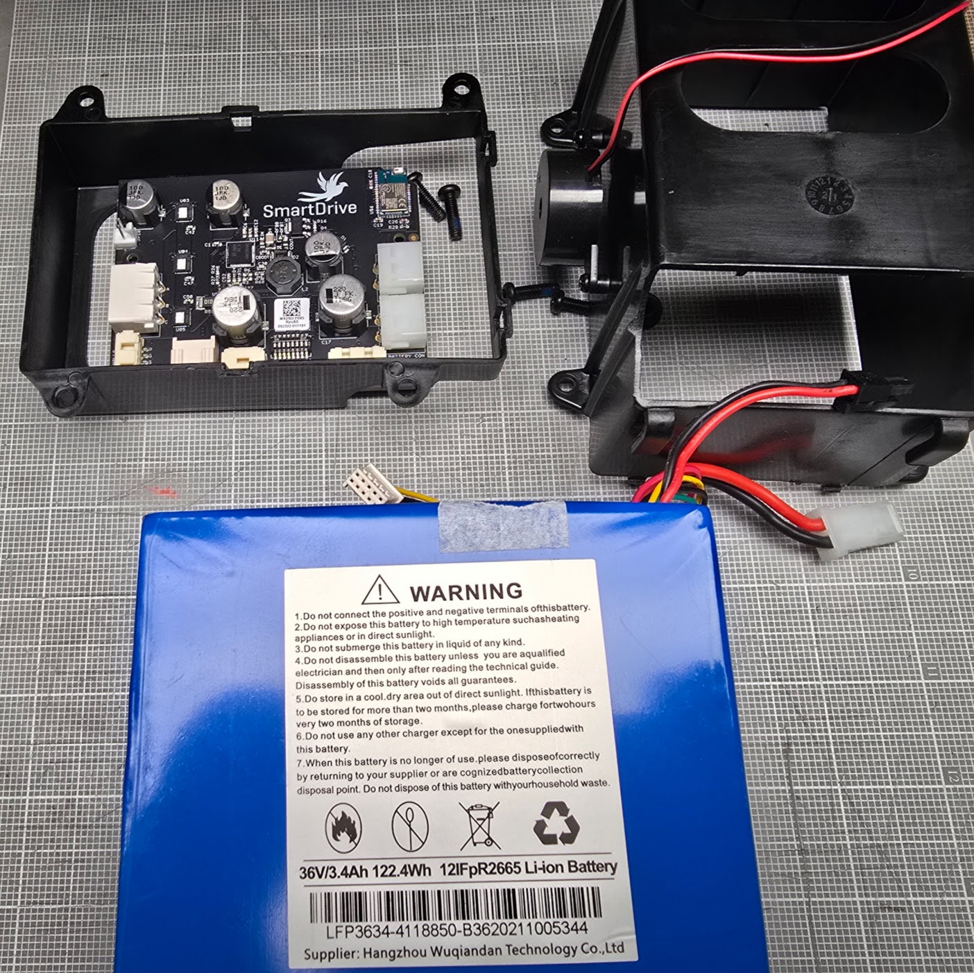 permobility_smartdrive_battery_pack_and controller_removed_from_housing_photo